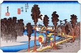 Namazu: Travellers walking along the river bank, lined with trees, towards the village ahead, under a huge full moon in a deep blue sky, one of them carrying on his back a large Tengu mask, the mark of a pilgrim to the Shinto shrine of Kompira on Shikoku Island. Dark forest of trees on further shore of river.<br/><br/>

Utagawa Hiroshige (歌川 広重, 1797 – October 12, 1858) was a Japanese ukiyo-e artist, and one of the last great artists in that tradition. He was also referred to as Andō Hiroshige (安藤 広重) (an irregular combination of family name and art name) and by the art name of Ichiyūsai Hiroshige (一幽斎廣重).<br/><br/>

The Tōkaidō (東海道 East Sea Road) was the most important of the Five Routes of the Edo period, connecting Edo (modern-day Tokyo) to Kyoto in Japan. Unlike the inland and less heavily travelled Nakasendō, the Tōkaidō travelled along the sea coast of eastern Honshū, hence the route's name.